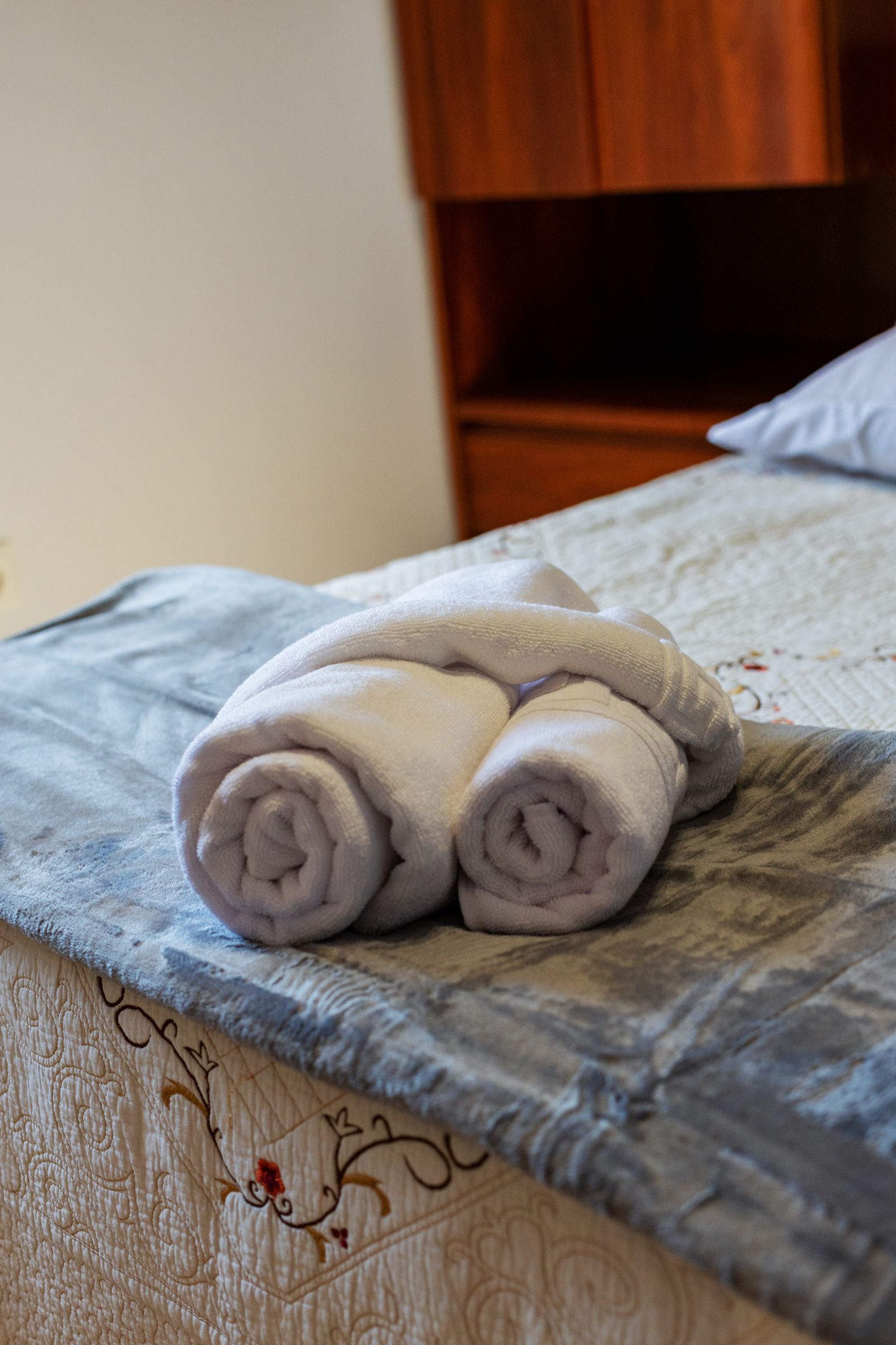 Luxury hotel room prepared with fresh linen and towels